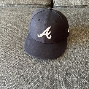 Atlanta Braves MLB hat.